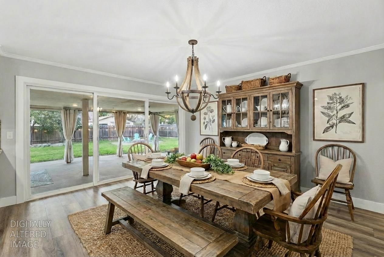 312 D Street Lincoln, CA 95648 - Photo 12 of 51 a dining room with furniture a chandelier and wooden floor