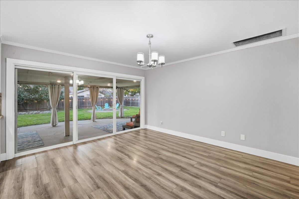 312 D Street Lincoln, CA 95648 - Photo 13 of 51 a view of an empty room with wooden floor and a window