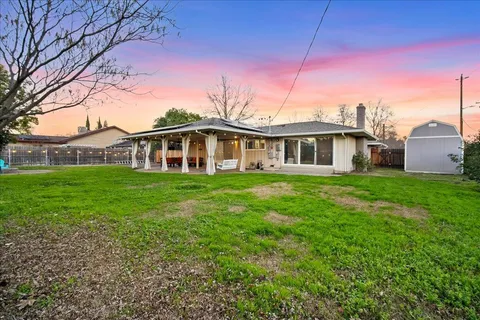 a view of a building with a backyard