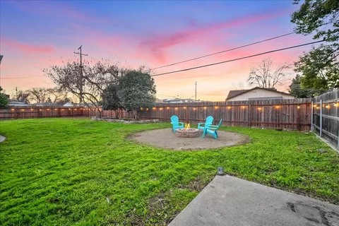 a view of a chairs and table in the yard