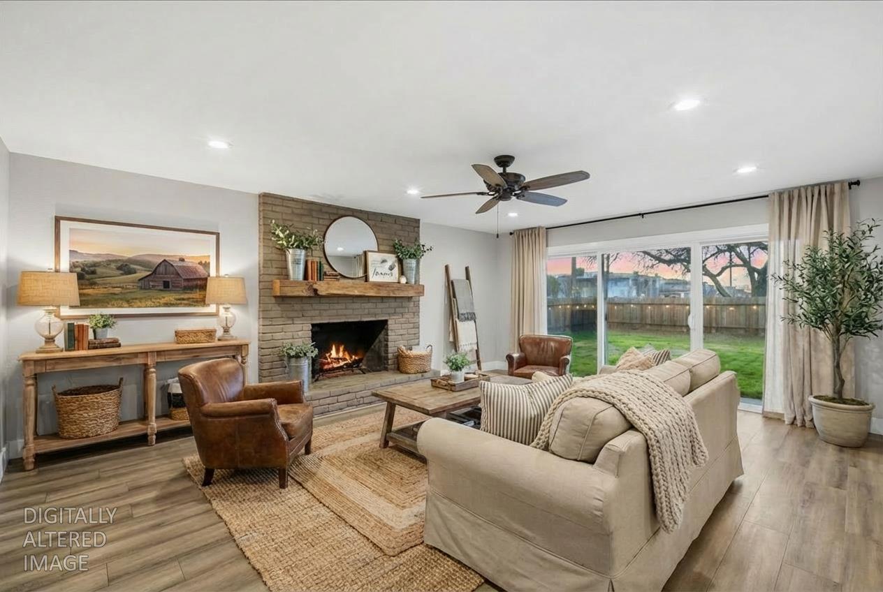 312 D Street Lincoln, CA 95648 - Photo 4 of 51 a living room with furniture a fireplace and a floor to ceiling window