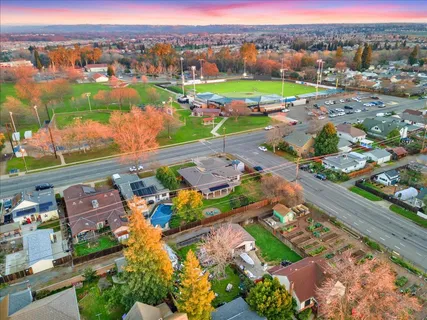 an aerial view of residential houses with outdoor space