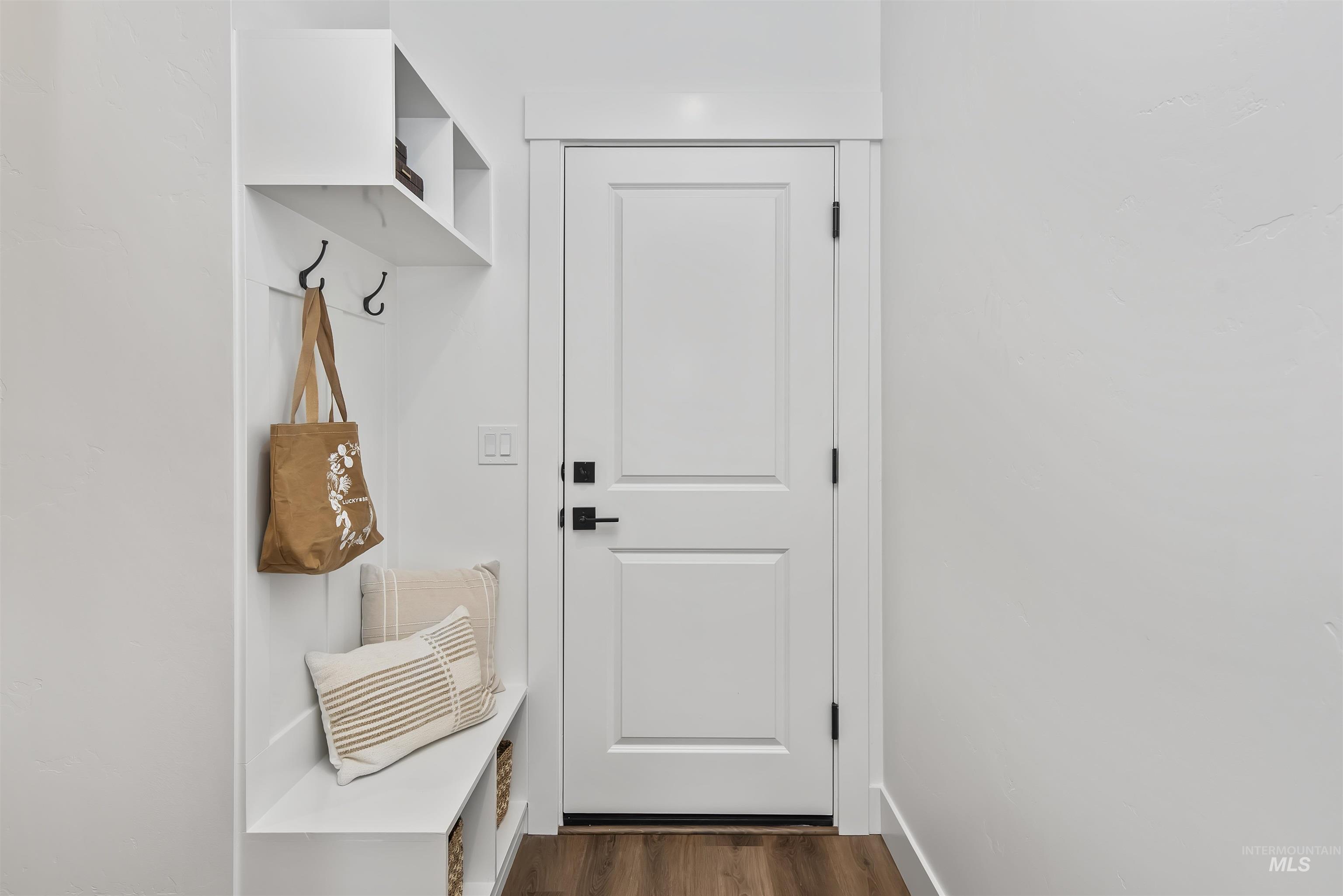 749 South Calhoun Lane Star, ID 83669 - Photo 3 of 34 Mudroom featuring dark wood-style flooring and baseboards