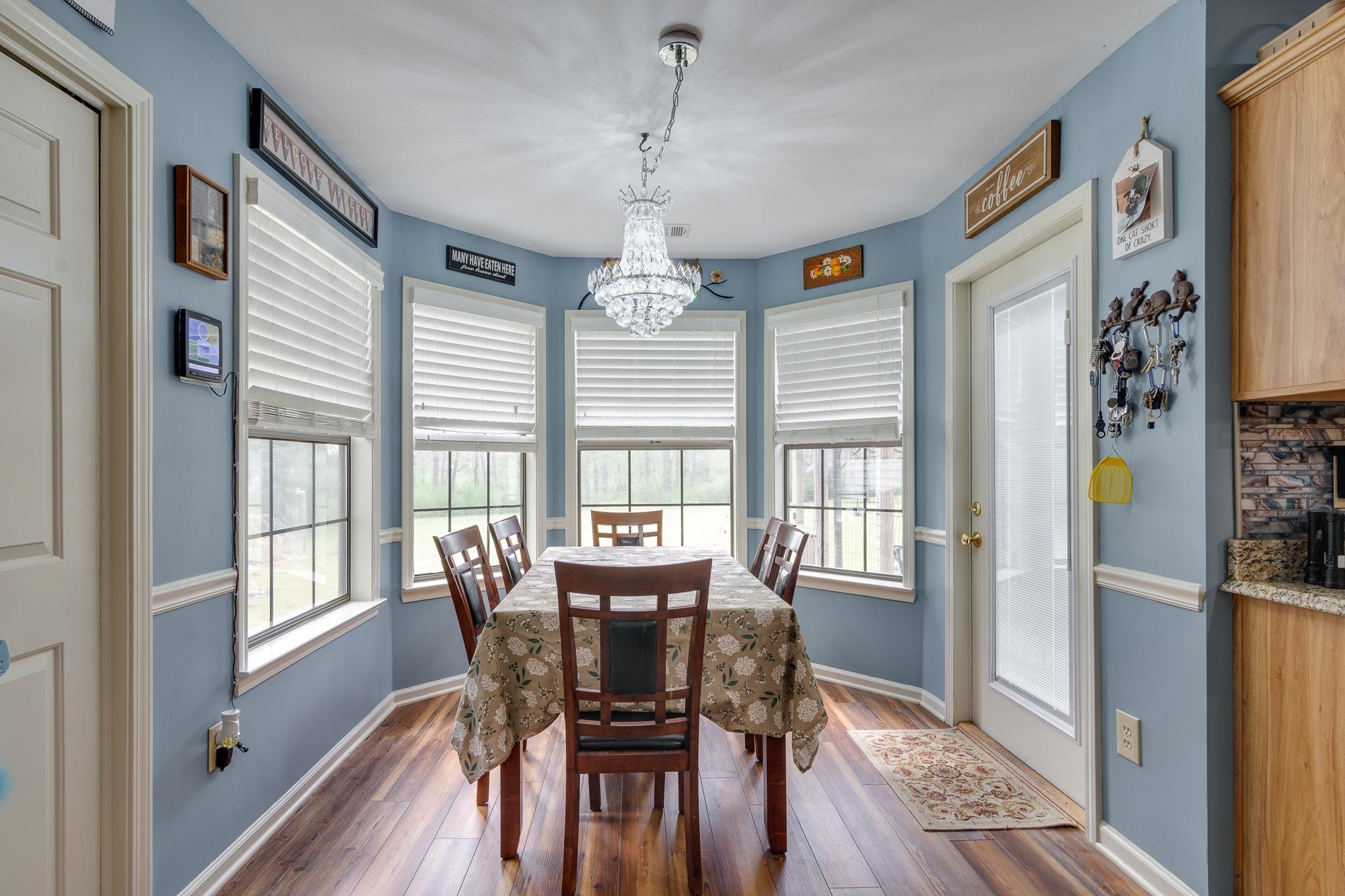 4099 Soderlund Cove Millington, TN 38053 - Photo 9 of 26 Dining area with dark wood finished floors and suspended lighting