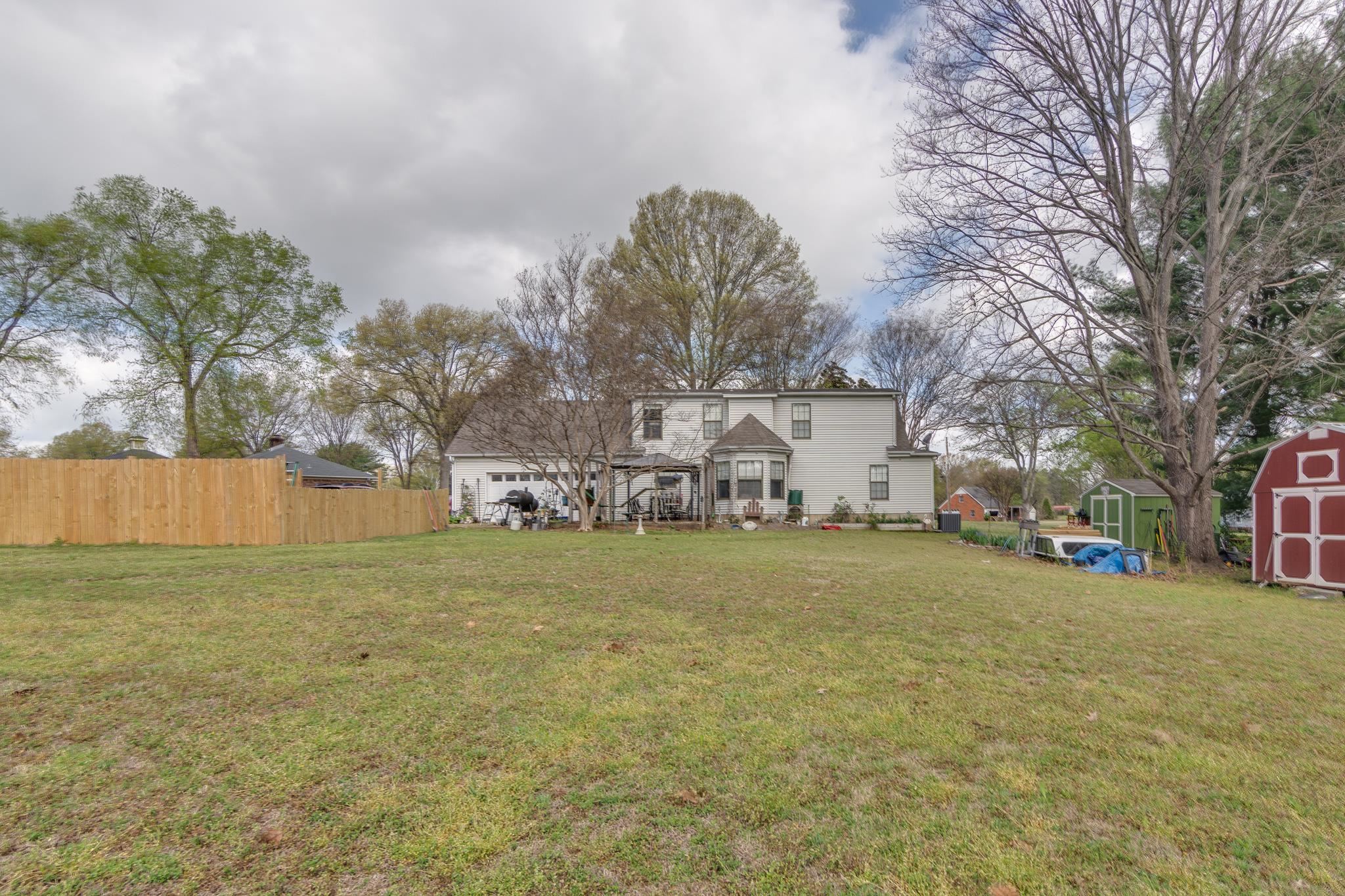 4099 Soderlund Cove Millington, TN 38053 - Photo 22 of 26 Rear view of house with a shed and a patio