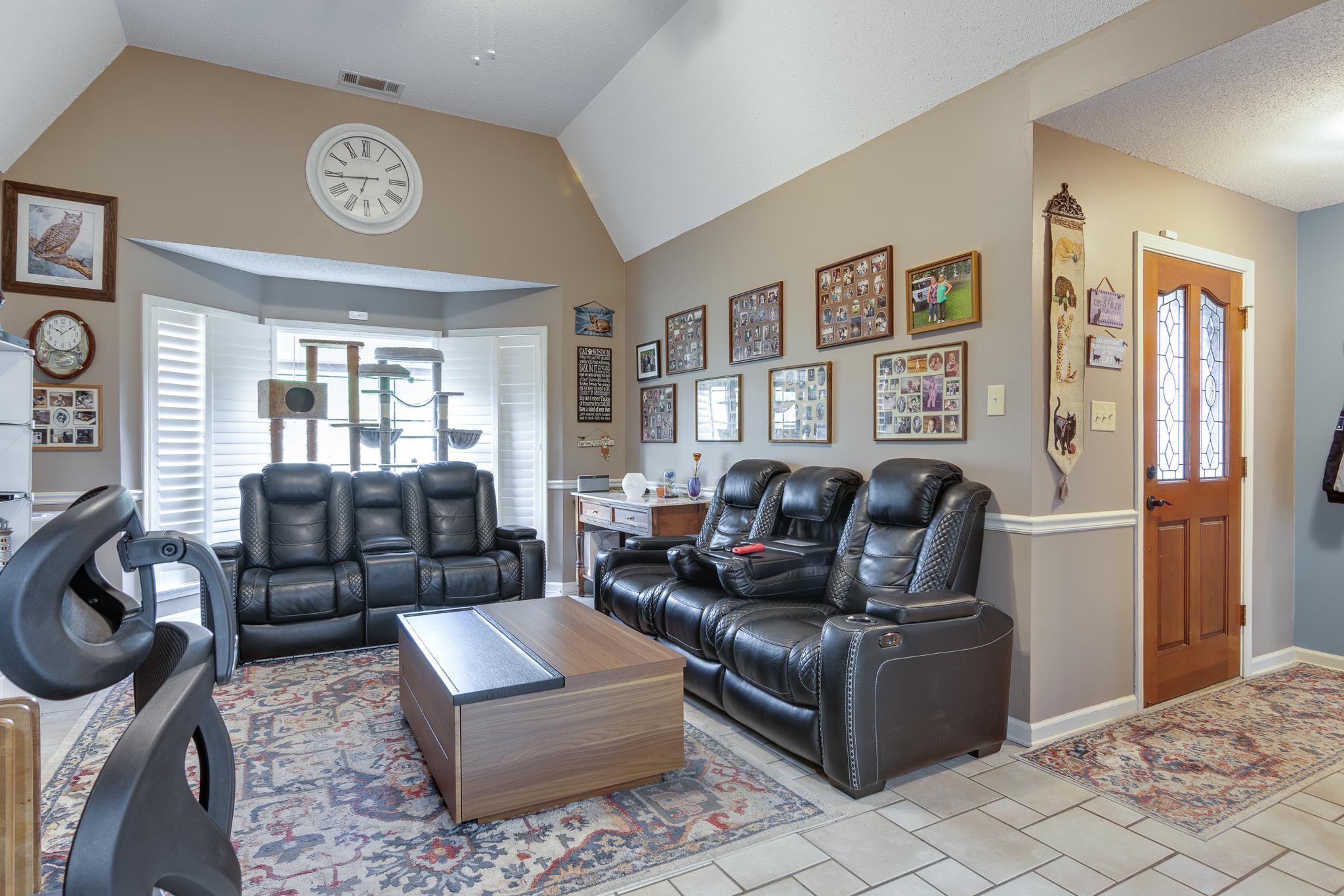 4099 Soderlund Cove Millington, TN 38053 - Photo 3 of 26 Living room featuring light tile patterned flooring and a high ceiling