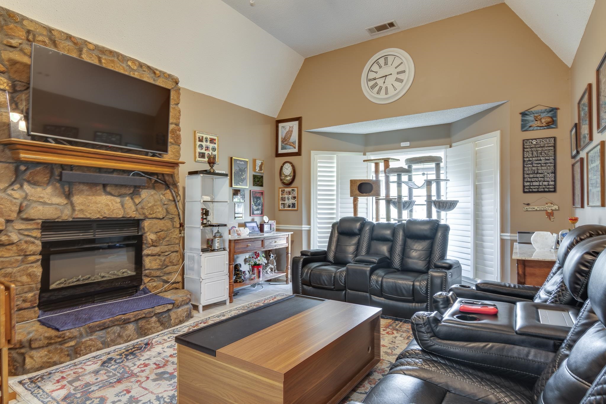 4099 Soderlund Cove Millington, TN 38053 - Photo 4 of 26 Living room with vaulted ceiling and a fireplace