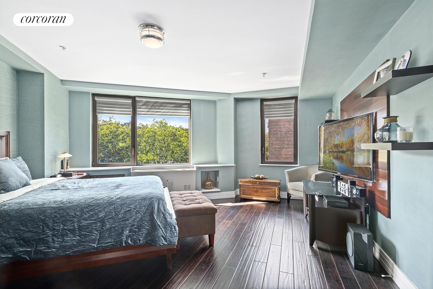 64-05 Yellowstone Boulevard, Unit 405A Queens, NY 11375 - Photo 4 of 7 a living room with furniture and a large window