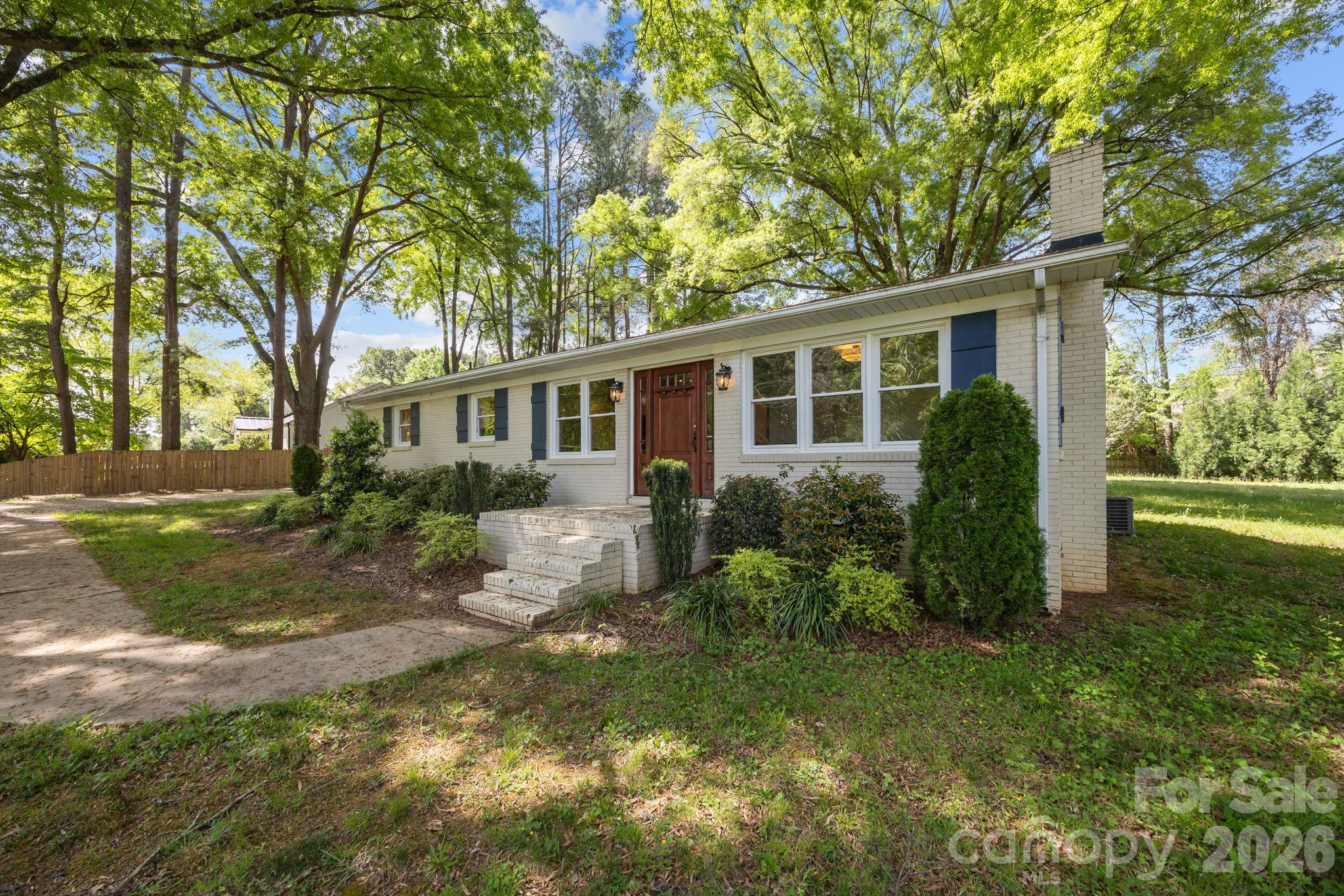 19041 Davidson-Concord Road Davidson, NC 28036 - Photo 3 of 48 front view of house with a yard