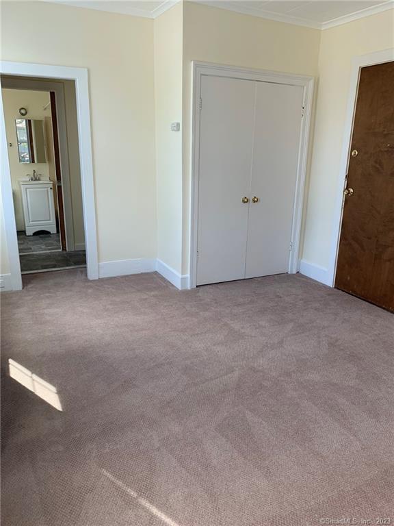 198 Flax Hill Road, Unit 3 Norwalk, CT 06854 - Photo 3 of 12 an empty room with closet