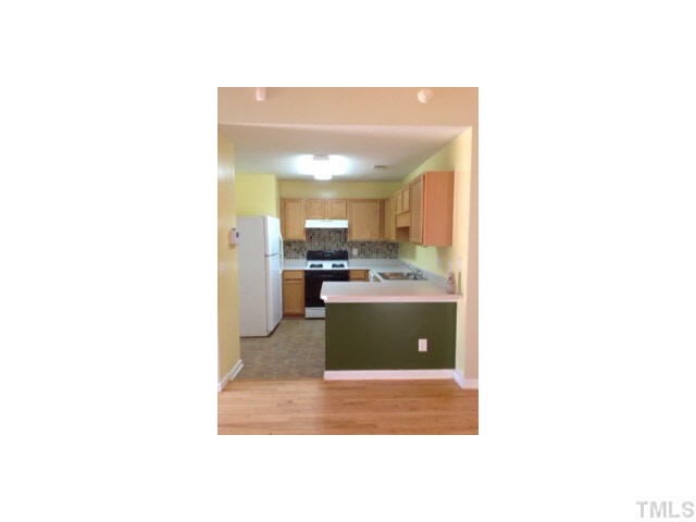 6200 Quitman Trail Raleigh, NC 27610 - Photo 7 of 10 a kitchen with a sink and cabinets