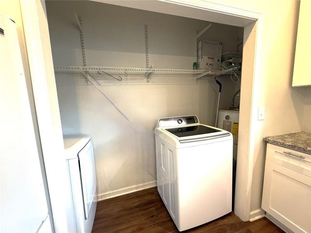 173 Cleveland Street Southeast Atlanta, GA 30316 - Photo 15 of 16 a utility room with wooden floor washer and dryer