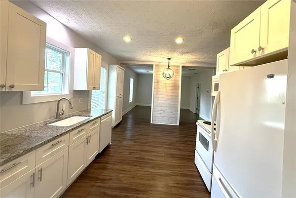 a bathroom with a double vanity sink and mirror
