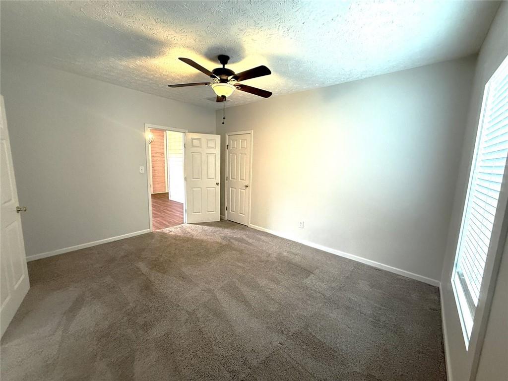 173 Cleveland Street Southeast Atlanta, GA 30316 - Photo 9 of 16 a view of a livingroom with a ceiling fan and window