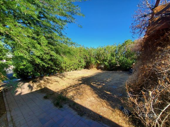 548 South Fairview Street Ridgecrest, CA 93555 - Photo 34 of 35 a view of a yard with wooden fence