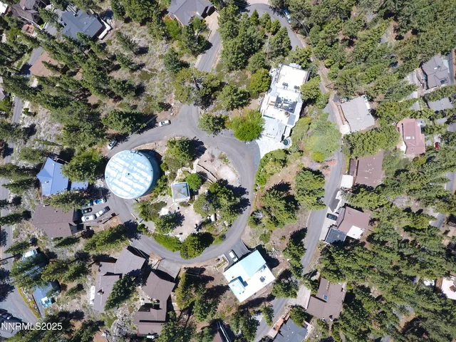 an aerial view of a backyard with outdoor space