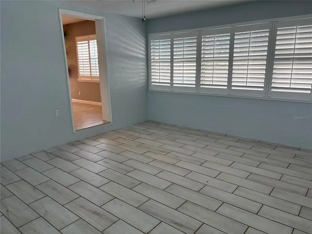 an empty room with windows