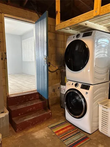 a view of a hallway with washer and dryer