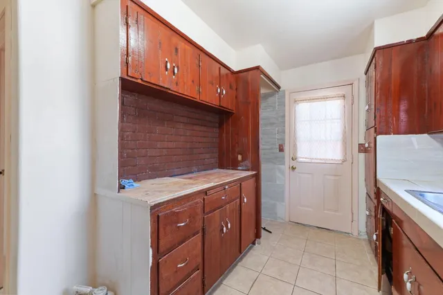 a kitchen with a cabinets and window
