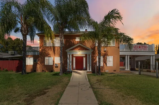 front view of a house with a yard