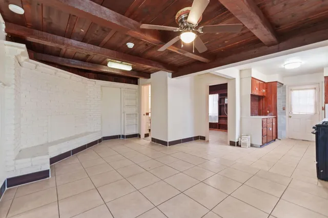 a view of an empty room with windows