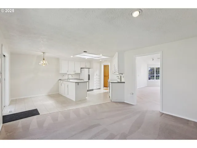 a view of kitchen with furniture and wooden floor