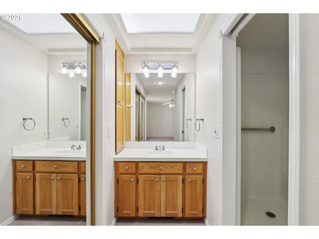 a bathroom with a granite countertop sink a mirror and a