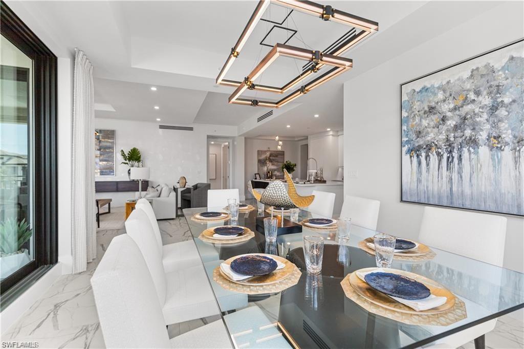 1130 3rd Avenue South, Unit 410 Avon Park, FL 33825 - Photo 13 of 21 Dining room with an inviting chandelier