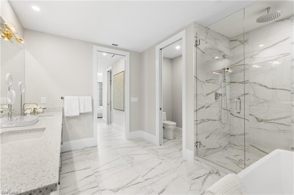 1130 3rd Avenue South, Unit 410 Avon Park, FL 33825 - Photo 5 of 21 Full bathroom with vanity, toilet, and independent shower and bath