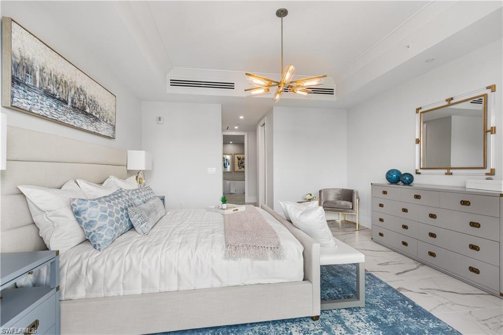 1130 3rd Avenue South, Unit 410 Avon Park, FL 33825 - Photo 7 of 21 Bedroom featuring ceiling fan and a tray ceiling