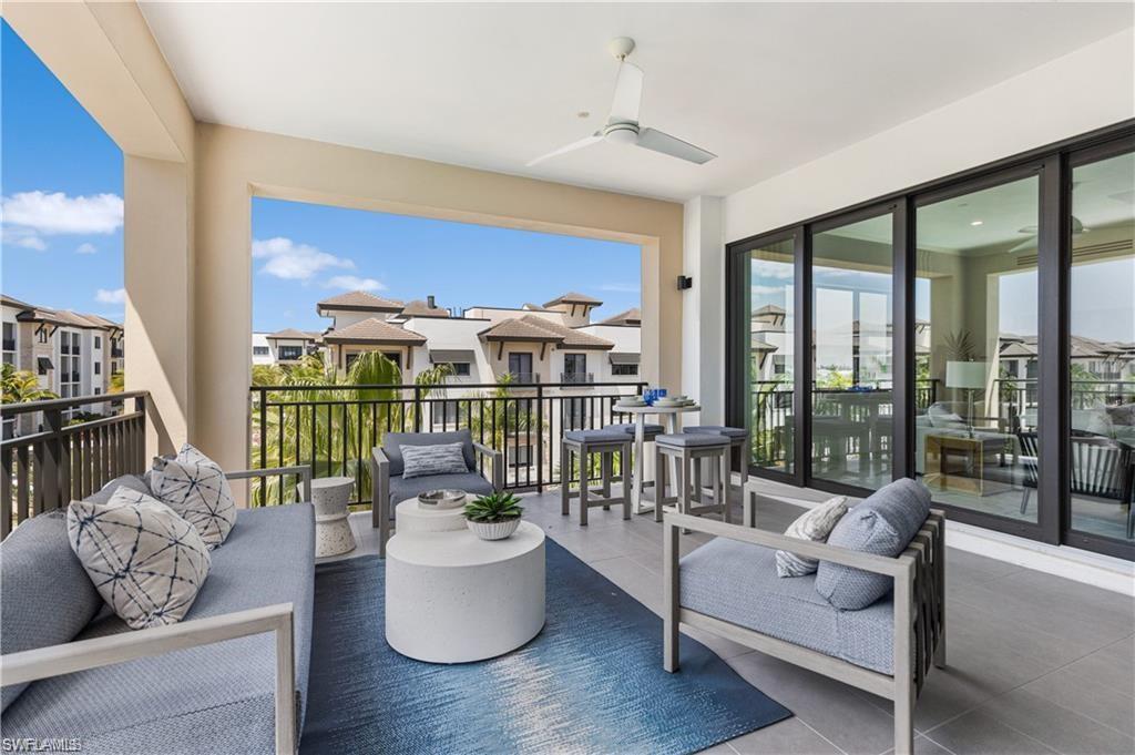1130 3rd Avenue South, Unit 410 Avon Park, FL 33825 - Photo 10 of 21 Balcony featuring an outdoor hangout area and ceiling fan