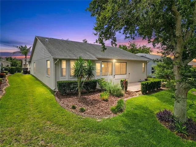 a living room with furniture or couch and a wooden floor