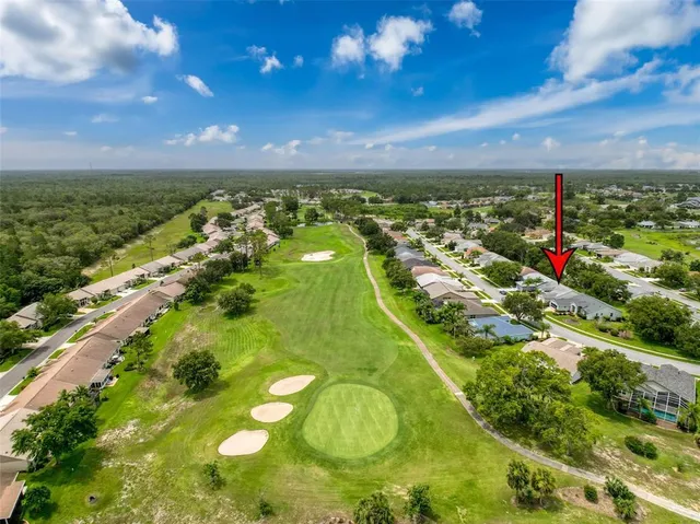 a view of empty room with window and ceiling fan
