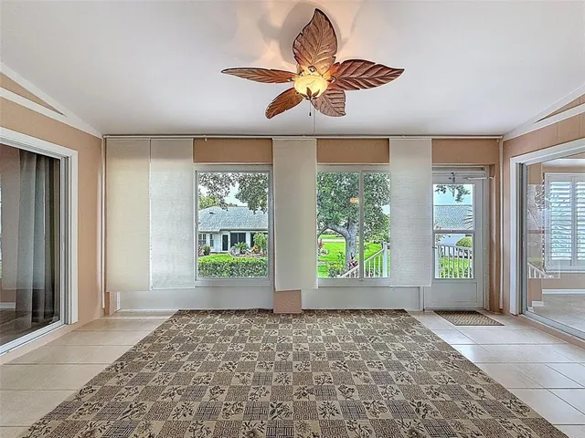 a front view of a house with a garden and yard