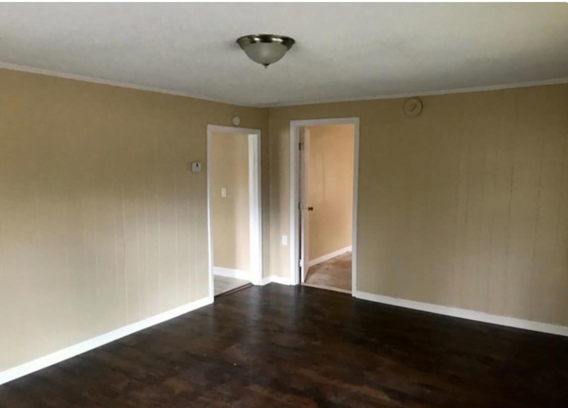 1432 Bridgewater Road Cordova, TN 38018 - Photo 8 of 8 an empty room with wooden floor and windows