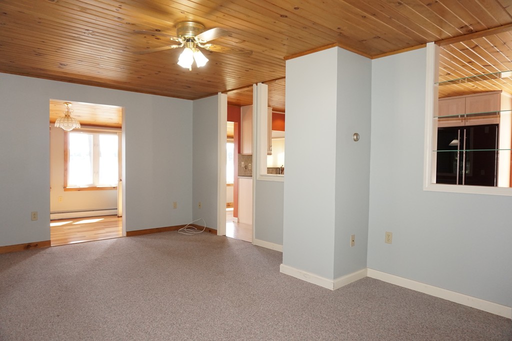 573 Reservoir Road Lunenburg, MA 01462 - Photo 12 of 26 a view of empty room with window and chandelier fan