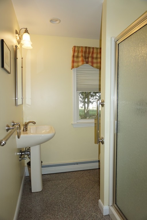 573 Reservoir Road Lunenburg, MA 01462 - Photo 15 of 26 a bathroom with a sink and a mirror