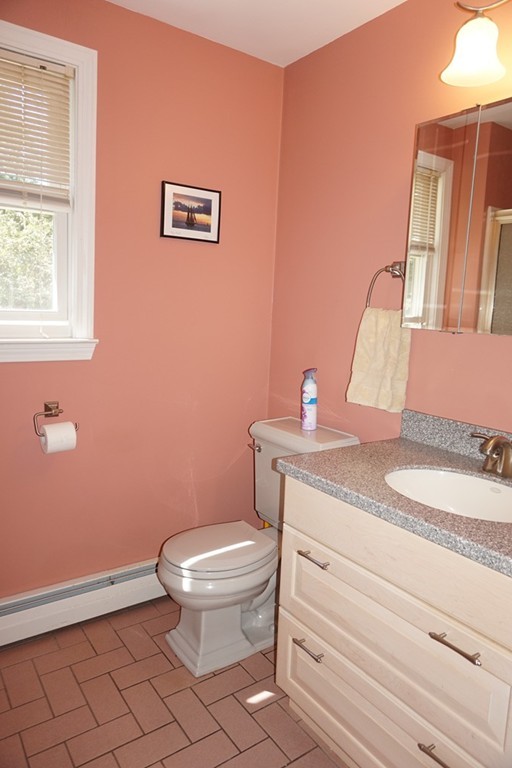 573 Reservoir Road Lunenburg, MA 01462 - Photo 16 of 26 a bathroom with a granite countertop toilet and a sink