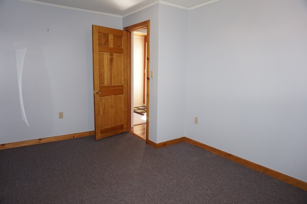 573 Reservoir Road Lunenburg, MA 01462 - Photo 18 of 26 an empty room with closet