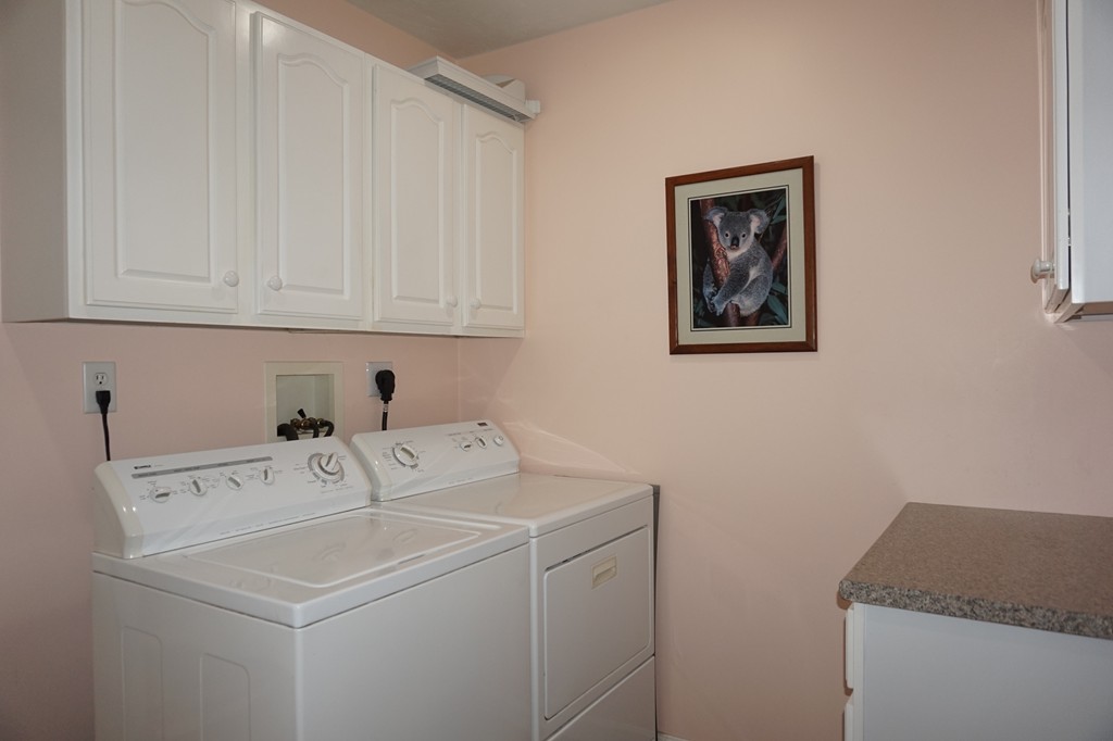 573 Reservoir Road Lunenburg, MA 01462 - Photo 19 of 26 a utility room with dryer and washer