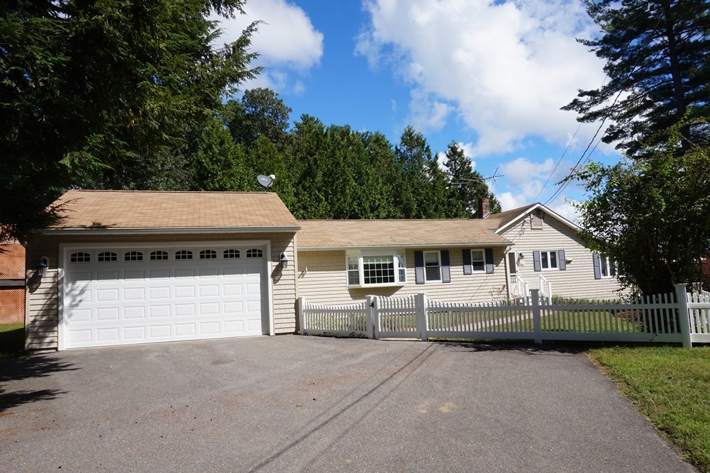 573 Reservoir Road Lunenburg, MA 01462 - Photo 2 of 26 front view of a house with a yard