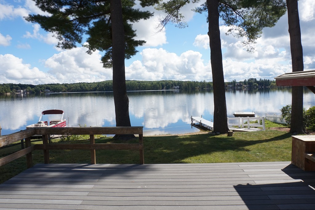 573 Reservoir Road Lunenburg, MA 01462 - Photo 26 of 26 a view of a lake with houses in front of it