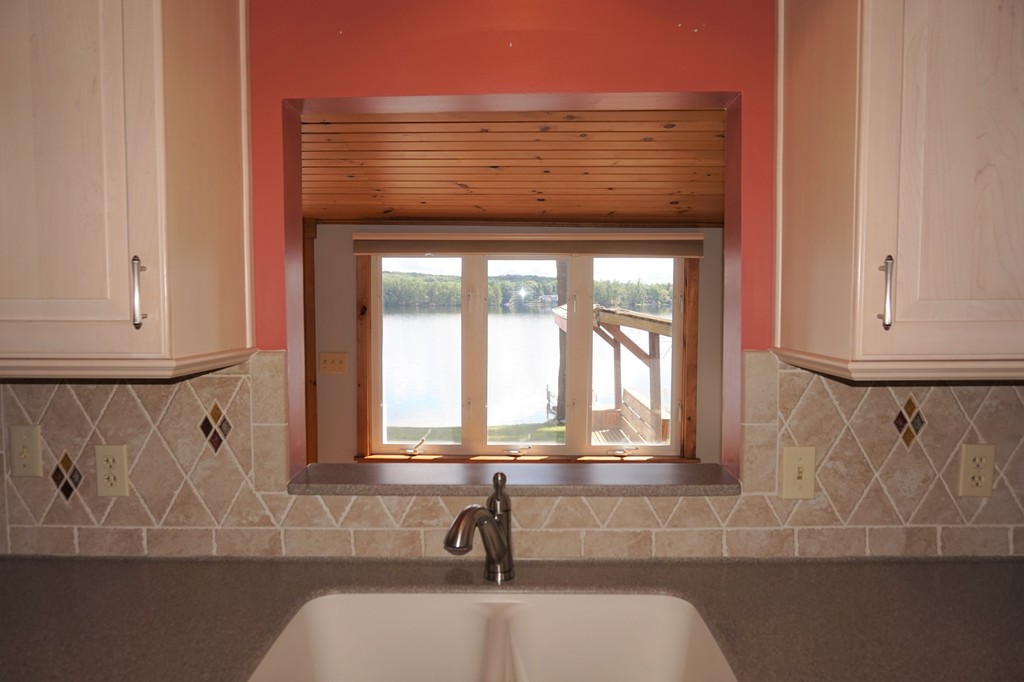 573 Reservoir Road Lunenburg, MA 01462 - Photo 6 of 26 a bathroom with a sink and a window