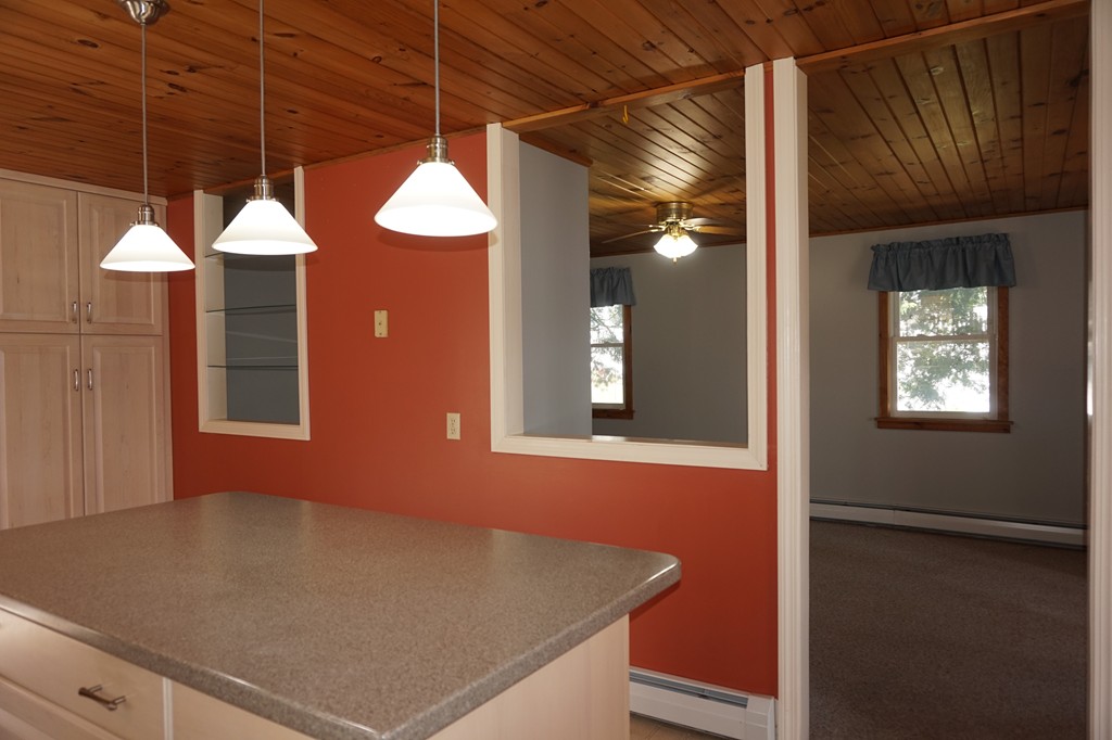 573 Reservoir Road Lunenburg, MA 01462 - Photo 9 of 26 a view of an empty room with a window