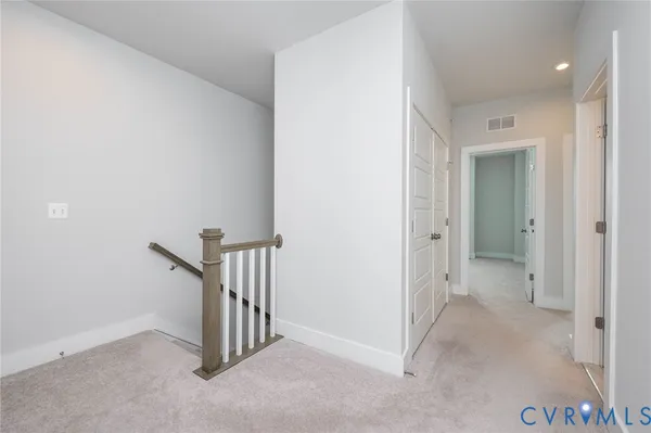 a view of a hallway and closet