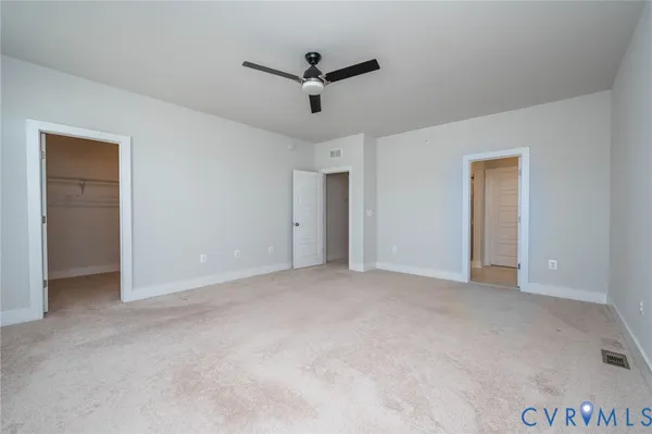 a view of a livingroom with a ceiling fan