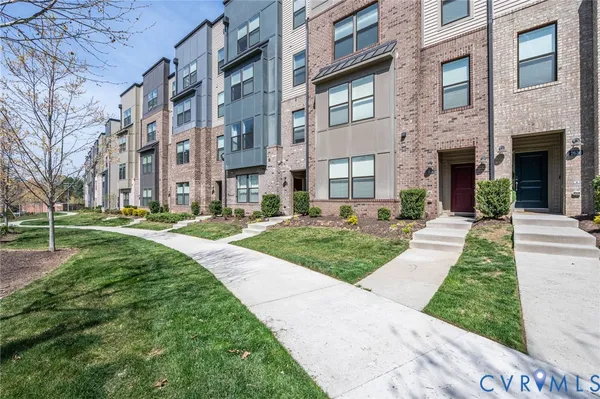 a view of a building with a yard