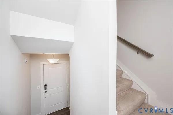 a view of staircase with white walls