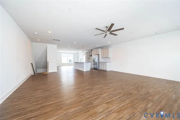a view of a kitchen with a sink and cabinets
