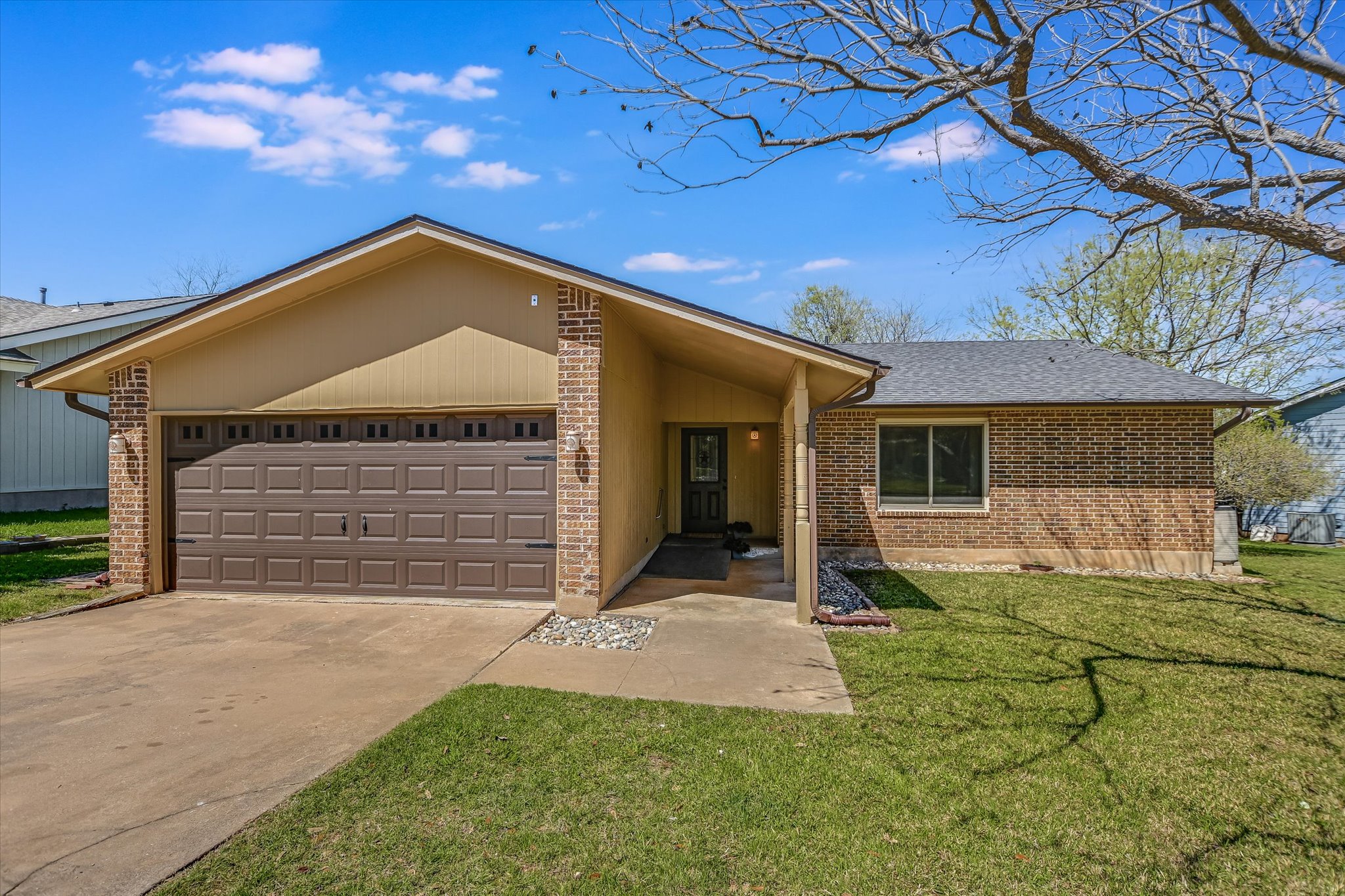 606 Splitrock Round Rock, TX 78681 - Photo 1 of 18 a front view of a house with a yard and garage
